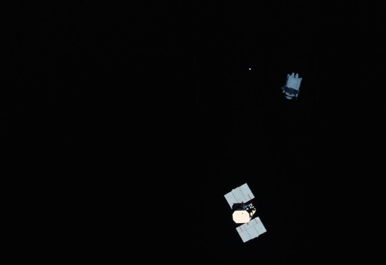 View of Astronaut Nelson using MMU to examine Solar Maximum Mission Satellite