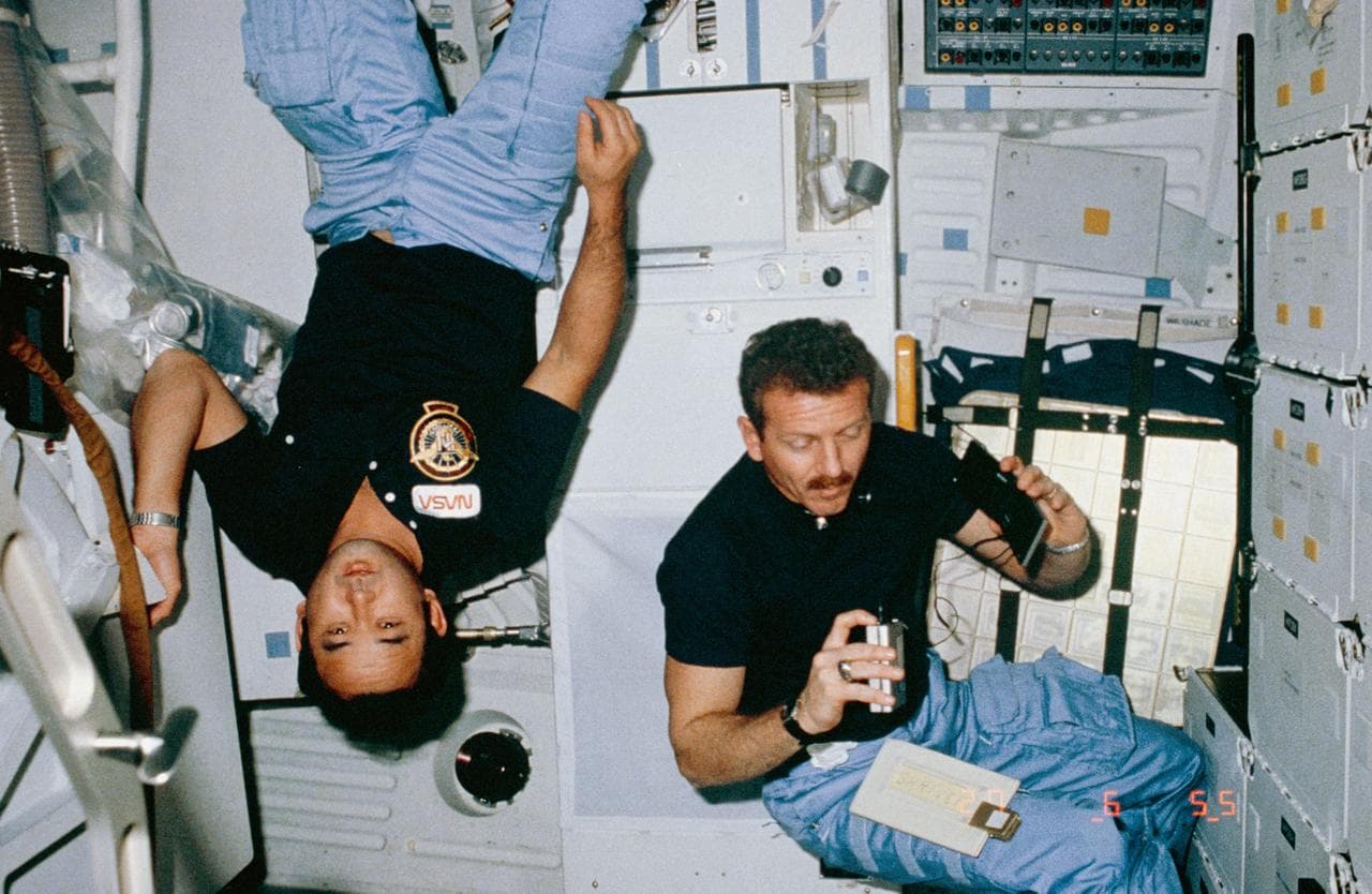Astronauts Onizuka and Shriver pose in middeck