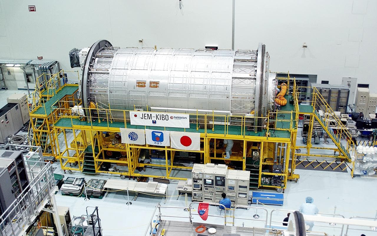 KENNEDY SPACE CENTER, FLA. -  International Space Station elements being processed for launch on upcoming Space Shuttle flights, including the Japanese Experiment Module (JEM) pressurized module, line the walls of the high bay in the Space Station Processing Facility. The JEM pressurized module, named "Kibo" (Hope), arrived at KSC on June 4. It is Japan's primary contribution to the Station.