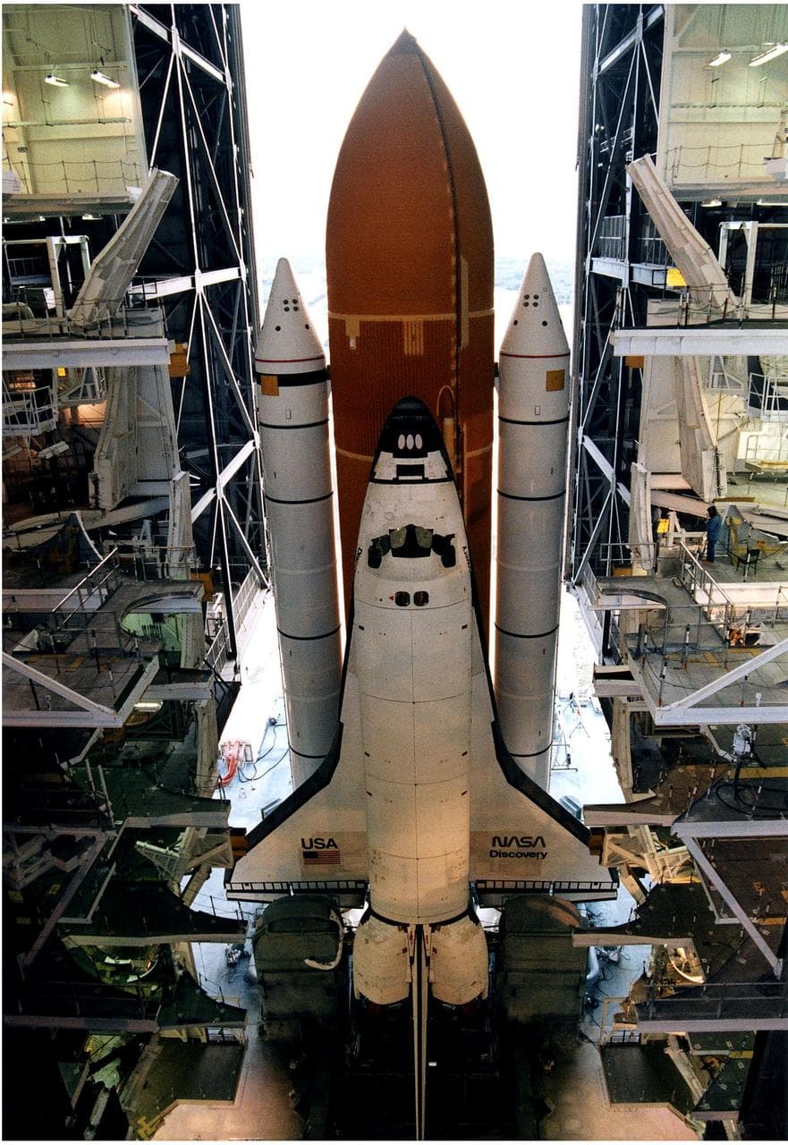 KENNEDY SPACE CENTER, FLA. -  After leaving the Vehicle Assembly Building, the Space Shuttle Discovery makes its slow - up to 1 mile per hour - trek along the crawlerway to Launch Pad 39A in preparation for the STS-82 mission.  The Shuttle is assembled on a Mobile Launcher Platform, seen in this view taken from above, and the entire assemblage is carried out to the launch pad on the crawler transporter, which is underneath the MLP.  A seven-member crew will perform the second servicing of the orbiting Hubble Space Telescope (HST) during the 10-day STS-82 mission, which is targeted for a Feb. 11 liftoff.