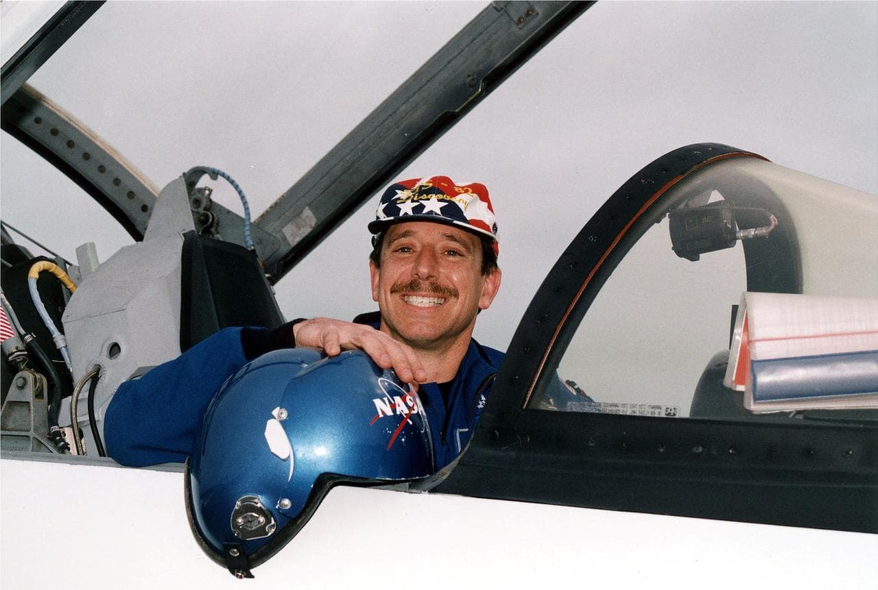 KENNEDY SPACE CENTER, FLA. -  STS-82 Pilot Scott J. "Doc" Horowitz flashes a wide grin for photographers after landing his T-38 jet at KSC's Shuttle Landing Facility.  Horowitz and the other six members of the STS-82 crew came from their home base at Johnson Space Center in Houston, Texas, to spend the last few days before launch at KSC.   STS-82 is scheduled for liftoff on Feb. 11 during a 65-minute launch window that opens at 3:56 a.m. EST.  The 10-day flight aboard the Space Shuttle Discovery will be the second Hubble Space Telescope (HST) servicing mission.