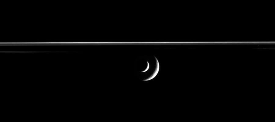 Enceladus Transits Rhea