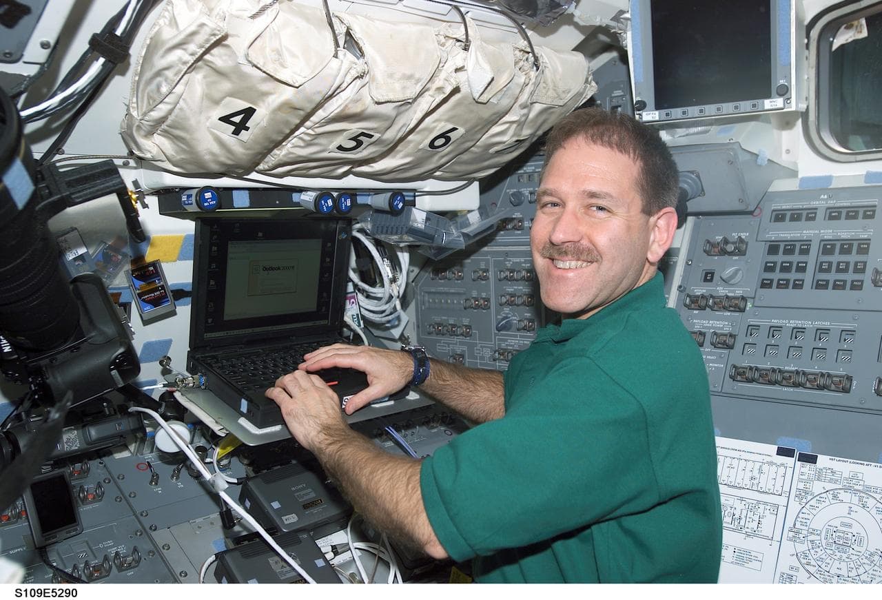 STS-109 MS Grunsfeld on aft flight deck