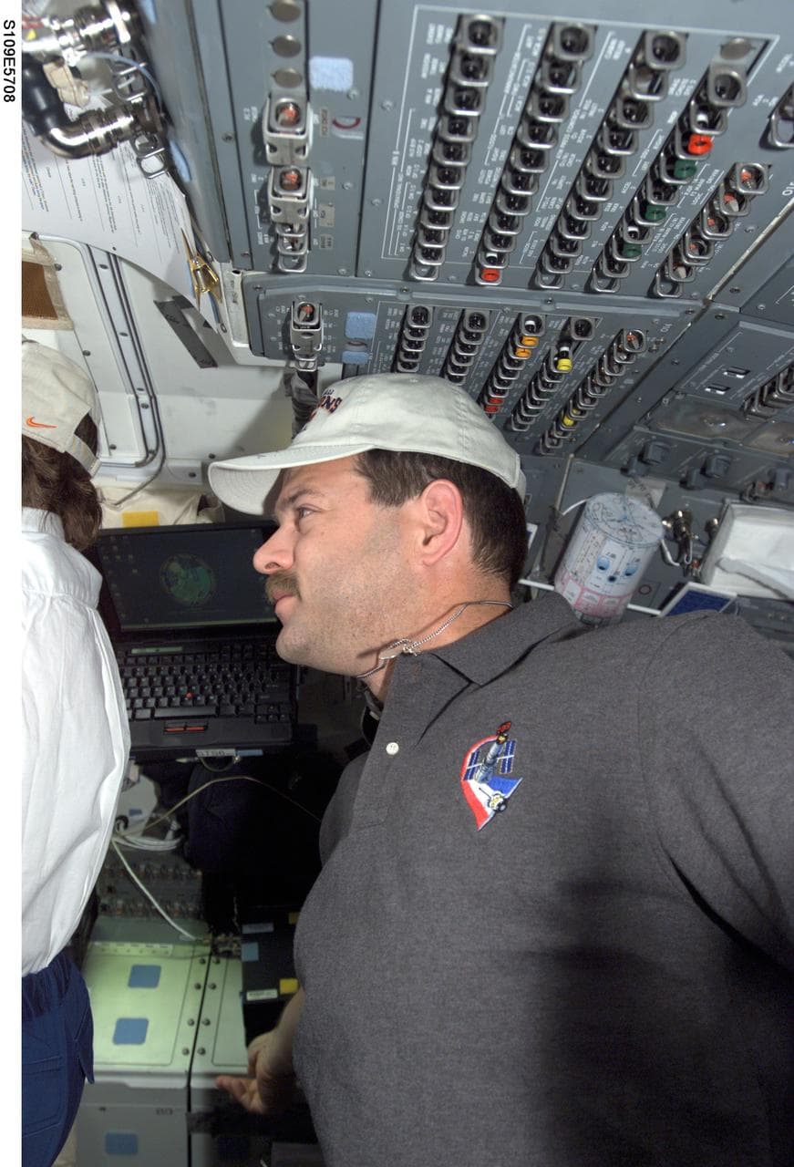 CDR Altman watches EVA 4 from aft flight deck
