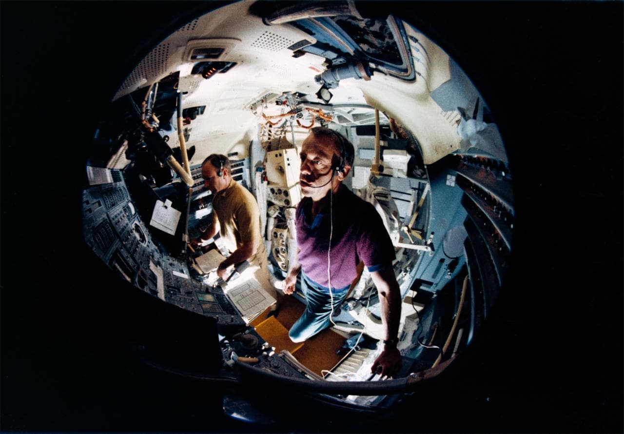Fish-eye lens view Astronauts Shepard and Mitchell in Lunar Module Simulator
