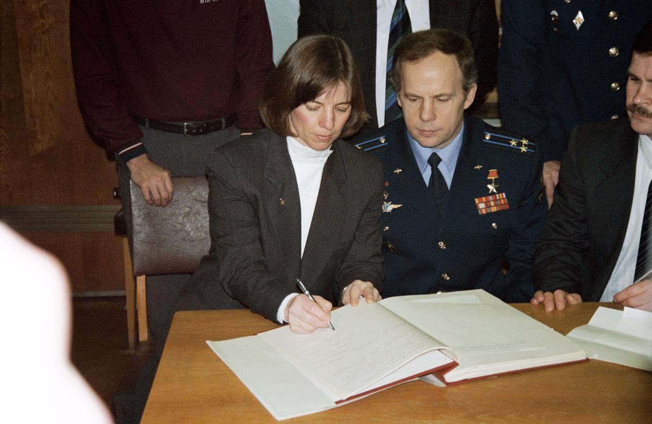 Astronauts & cosmonauts sign Gagarin's diary