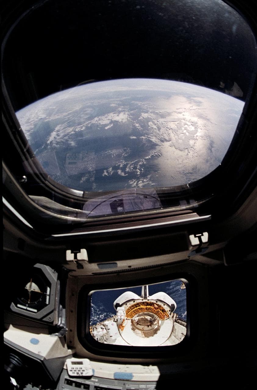 View of the Discovery's payload bay during EVA taken from inside shuttle