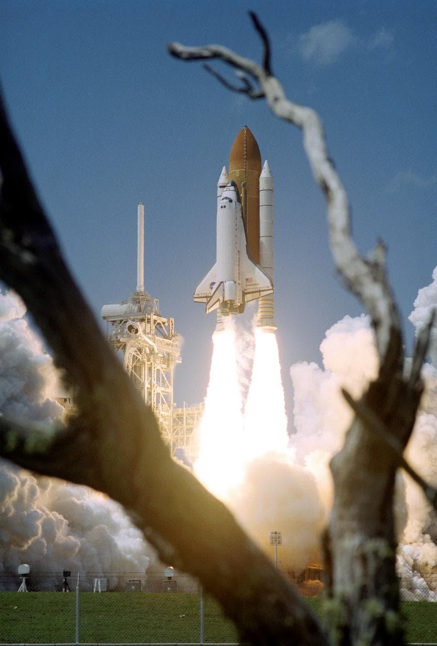 View of the launch of the Space Shuttle Endeavour at KSC to start the STS-100 mission