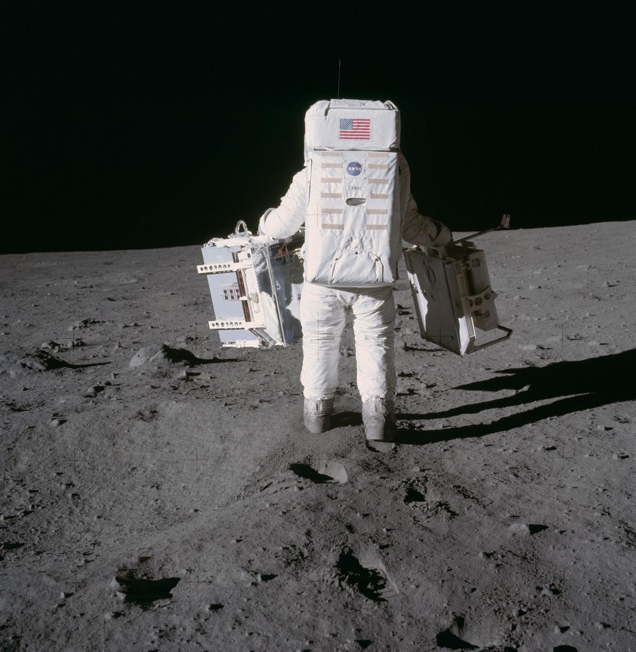 Astronaut Edwin Aldrin prepares to deploy EASEP on surface of moon