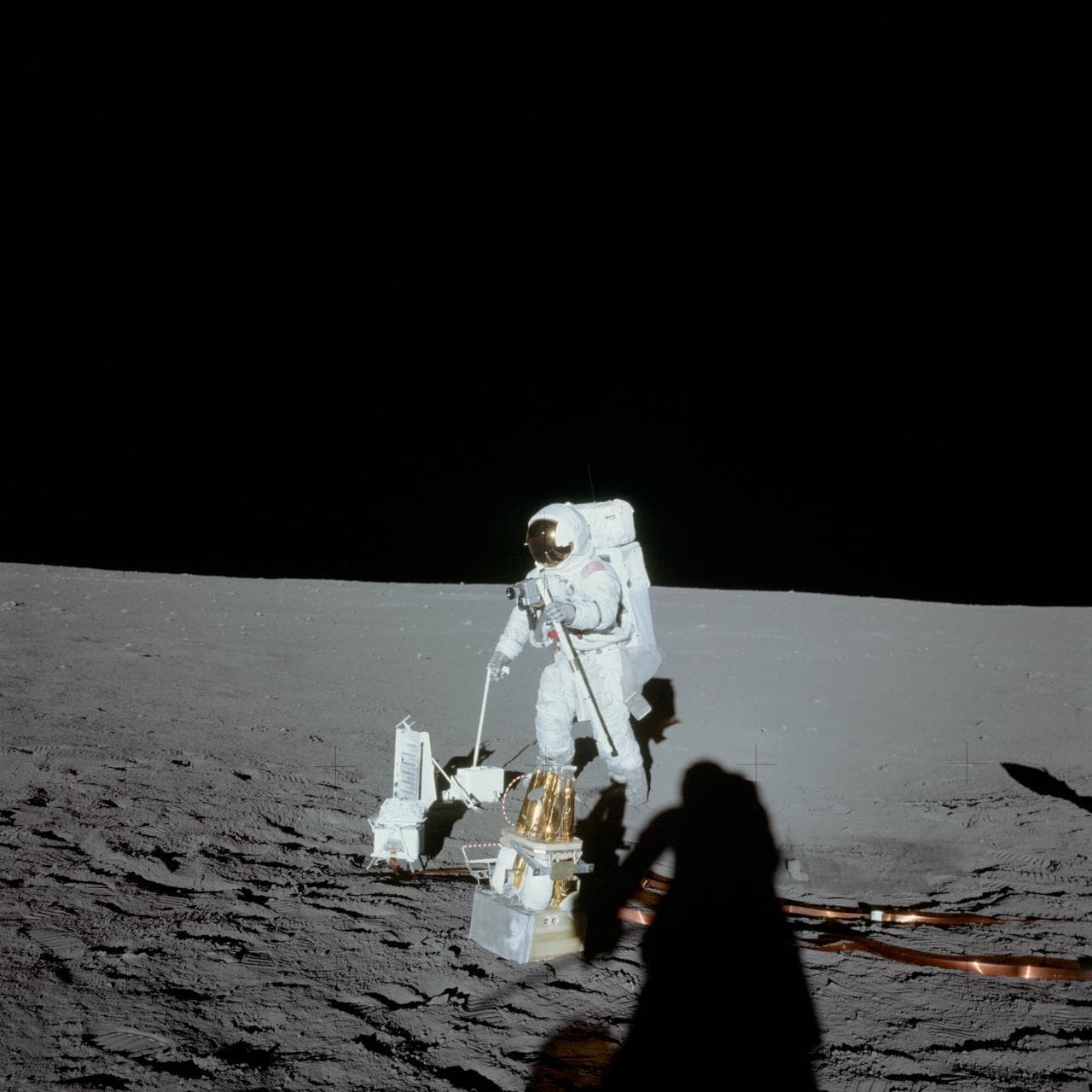 Astronaut Alan Bean deploys ALSEP during first Apollo 12 EVA on moon