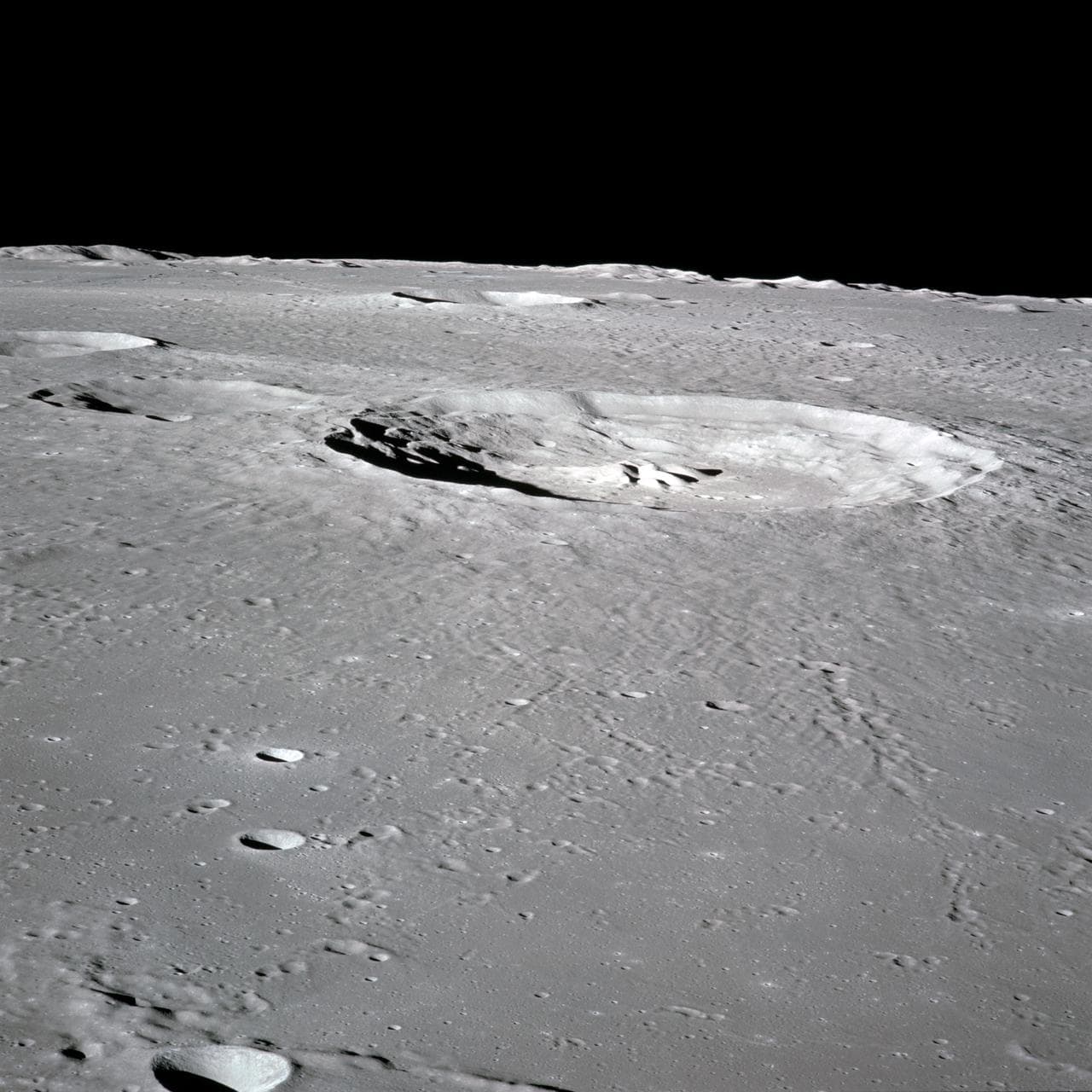 Apollo 16 Mission image - 70mm handheld camera view of the moon featuring the Bullialdus Crater.