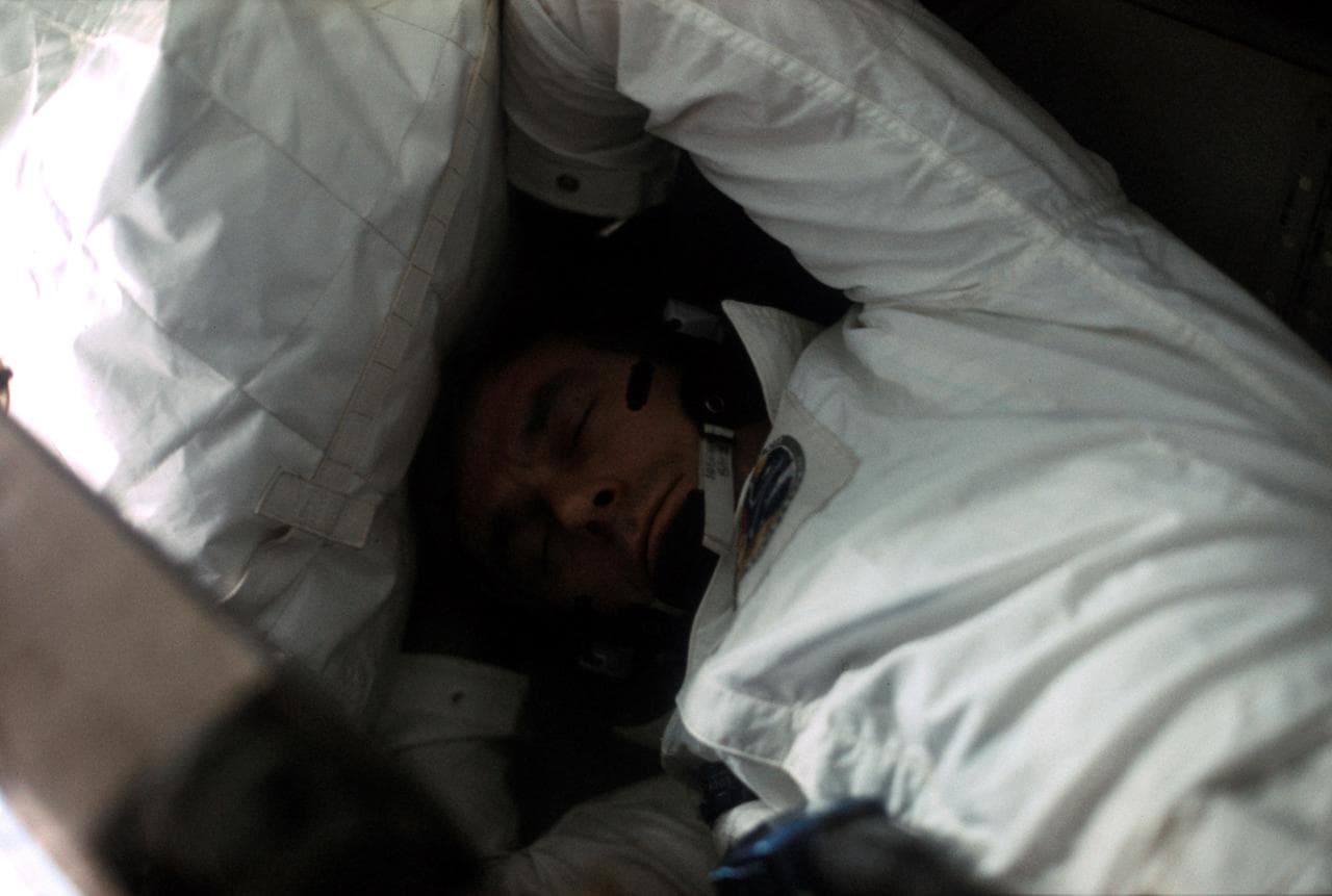 Astronaut Eugene Cernan sleeping aboard Apollo 17 spacecraft