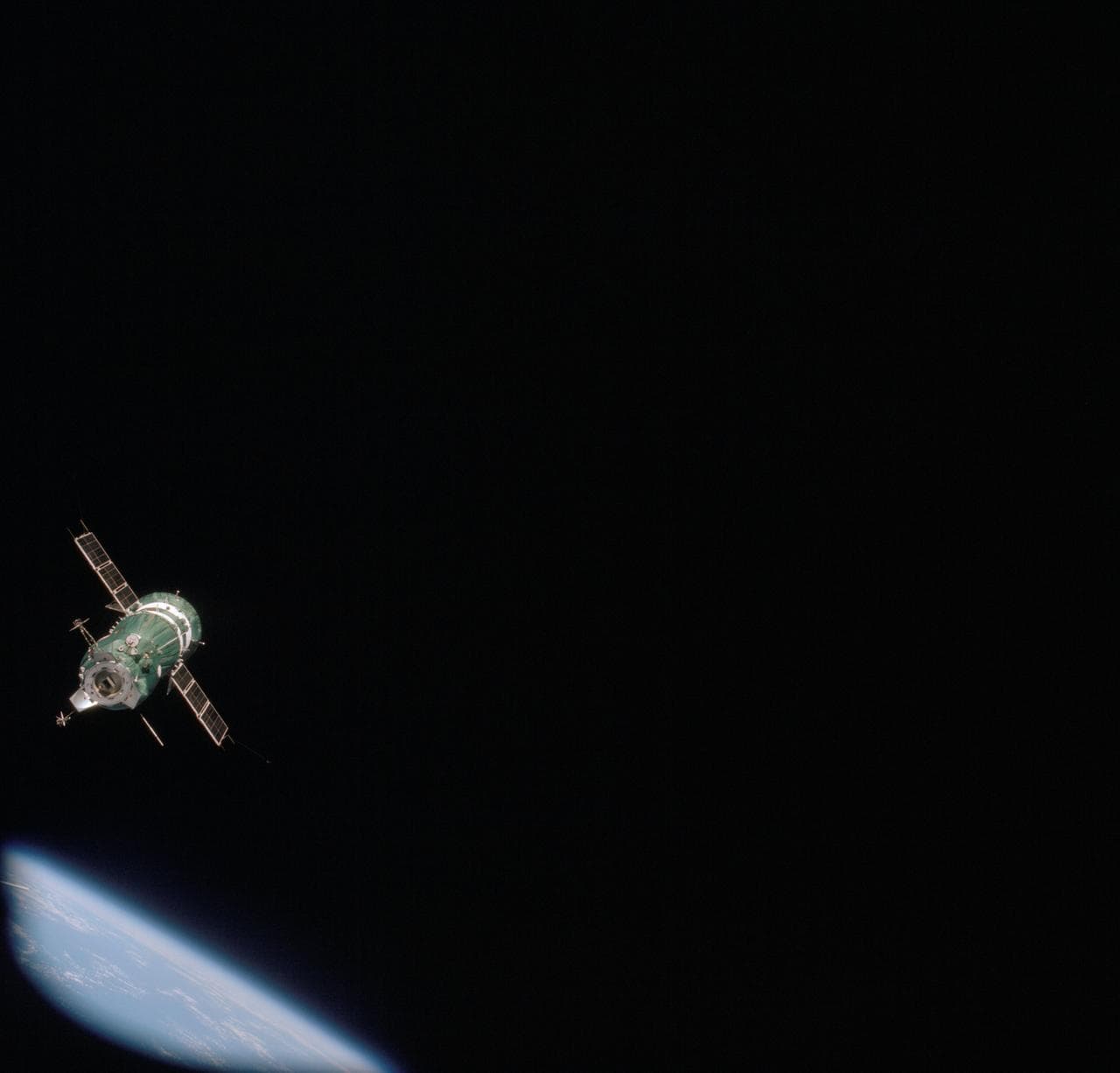 Soviet Soyuz spacecraft contrasted against a black-sky background