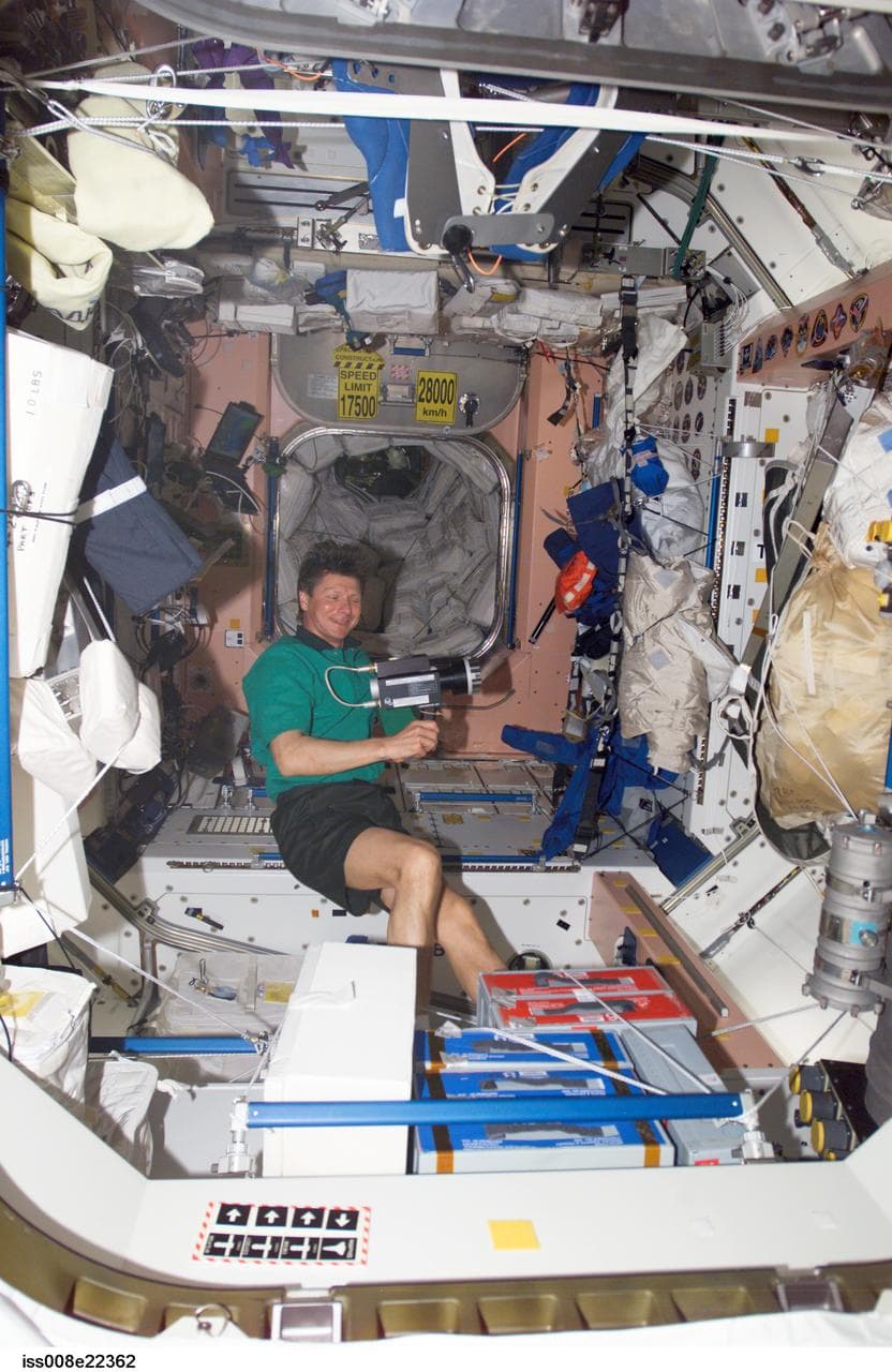 Padalka collects air samples in the SM during Expedition 9 / Expedition 8