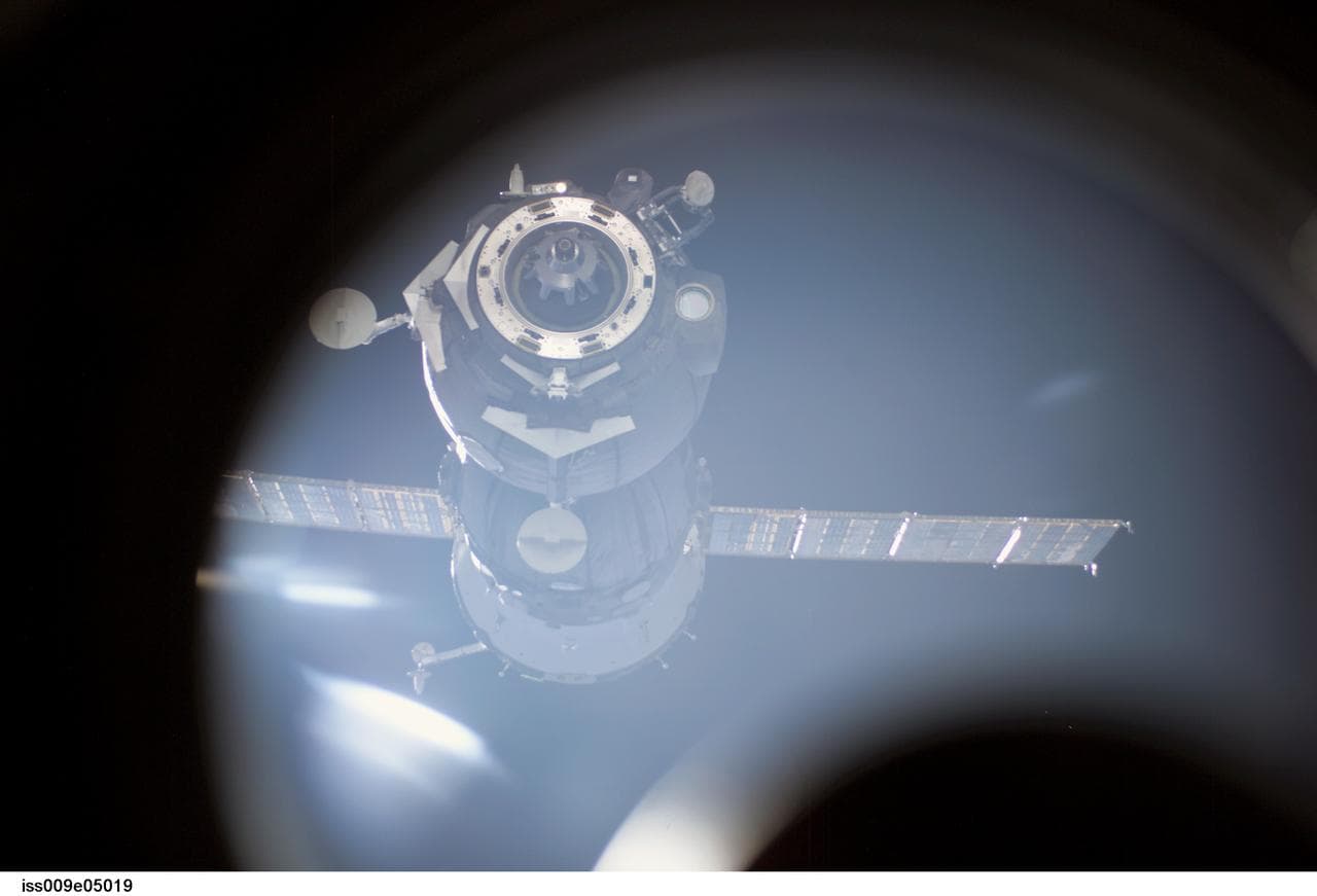 Soyuz TMA-3 separates from the Space Station after undocking, taking the Expedition 8 crew back to Earth