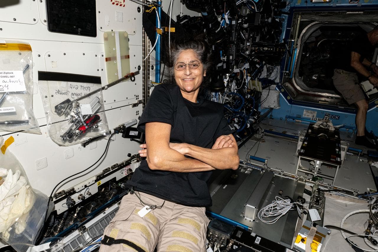 NASA astronaut Suni Williams smiles for a photograph aboard the International Space Station