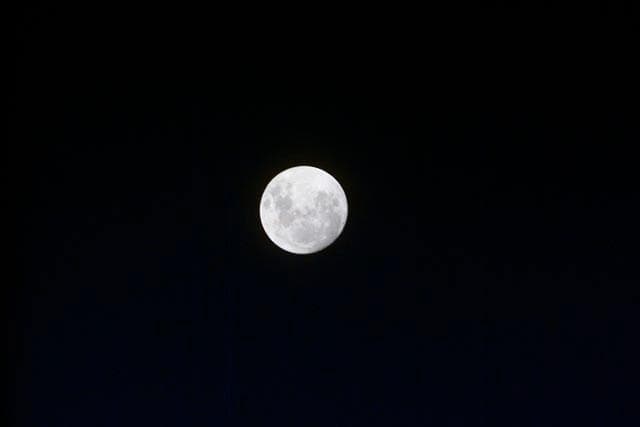 Full moon as seen from STS-103 orbiter Discovery.