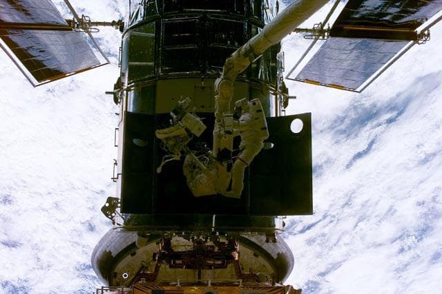 EVA 1 - Grunsfeld and Smith during RSU changeout