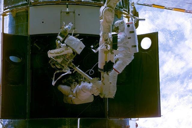 EVA 1 - Grunsfeld and Smith during RSU changeout