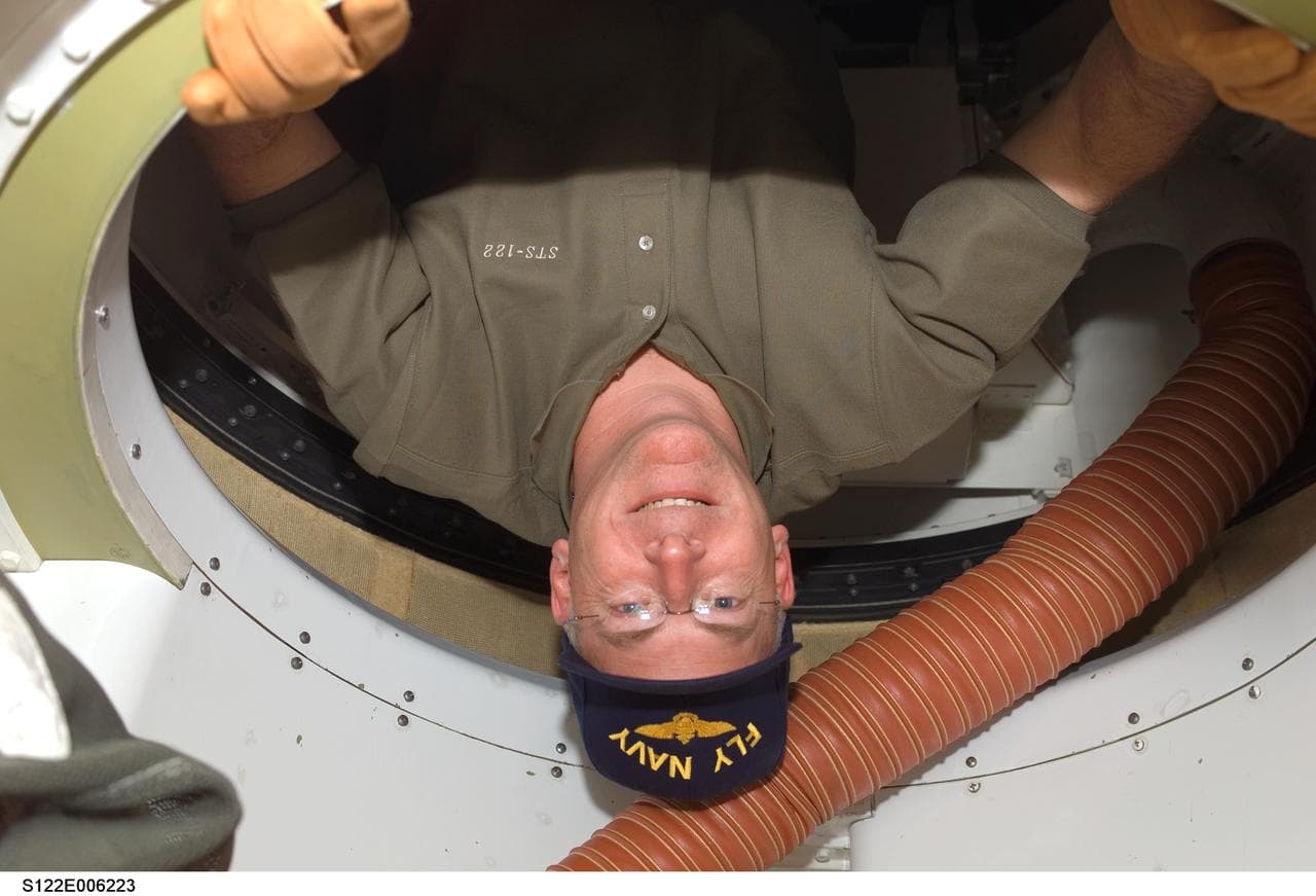 Poindexter in hatch area of MDDK during STS-122