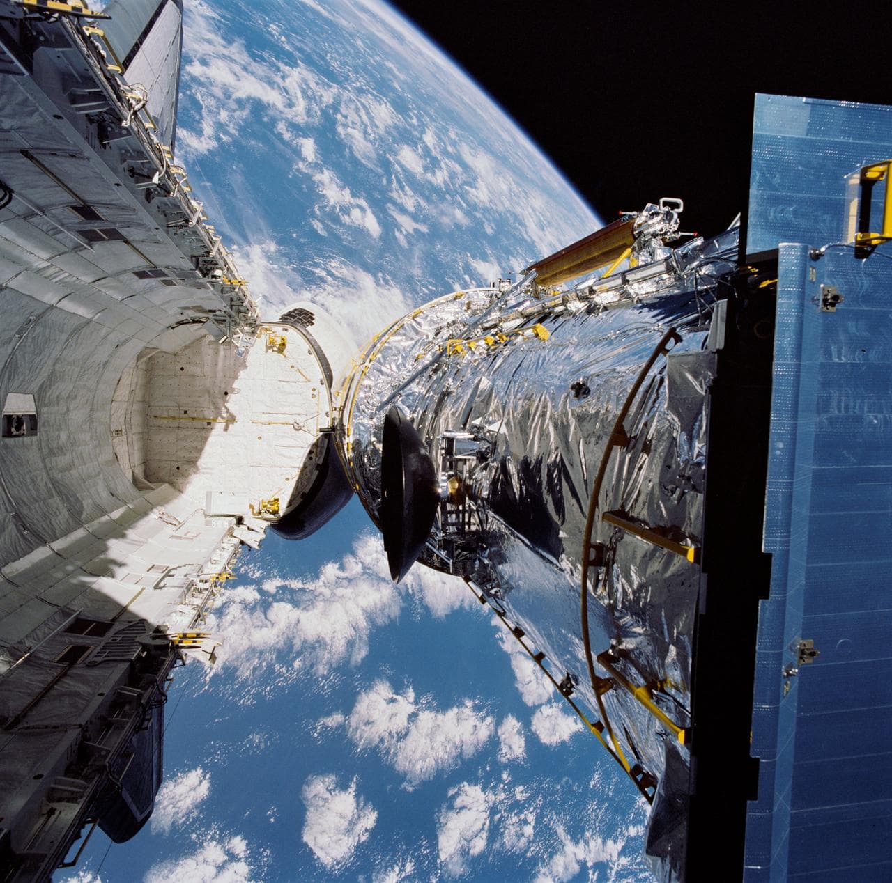 STS-31 pre-deploy check of the Hubble Space Telescope (HST) in OV-103's PLB