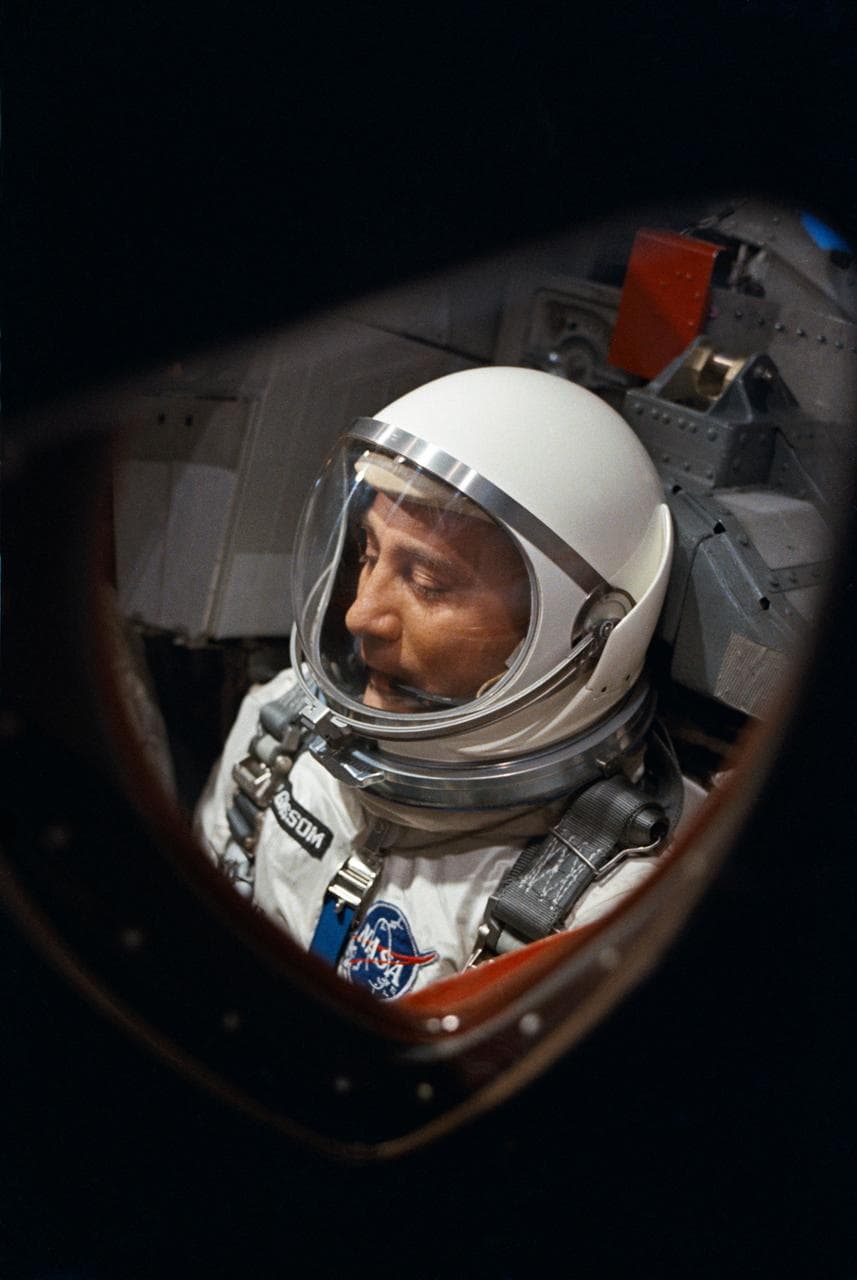 View of Astronaut Virgil Grissom through spacecraft window prior to launch