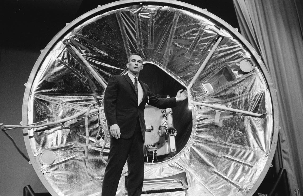 Astronaut Gene Cernan poses in front of Gemini Mission Simulator