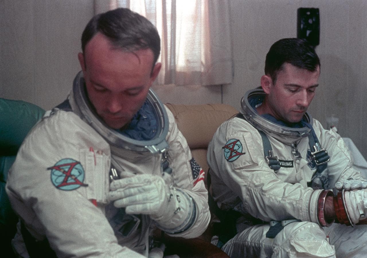Astronauts Young and Collins undergo suiting up operations during countdown