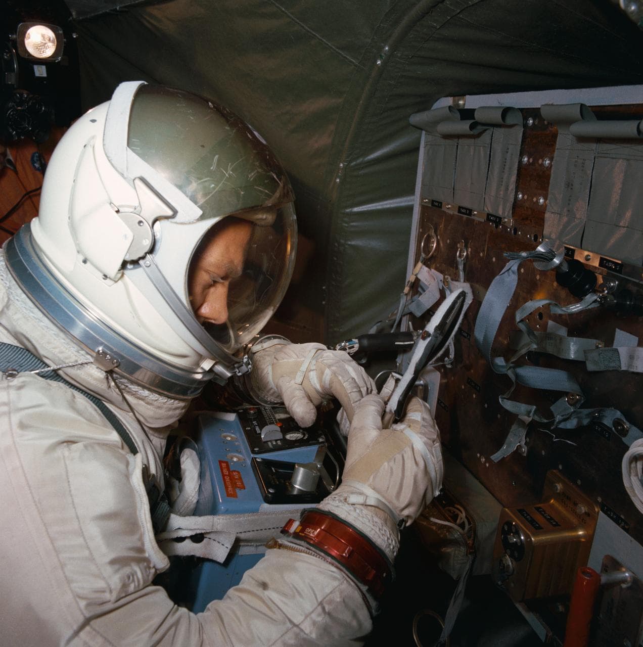 Astronaut Edwin Aldrin practices work task aboard KC-135