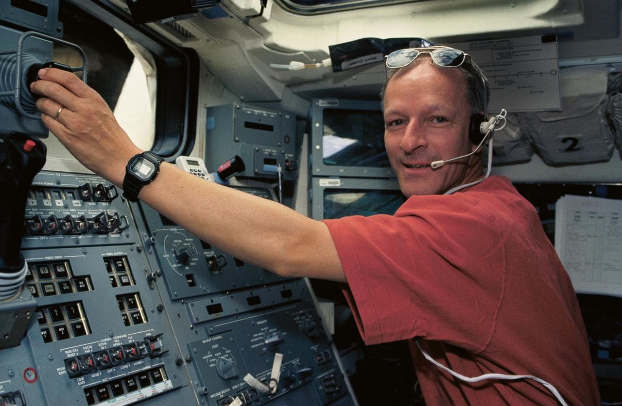 Astronaut Claude Nicollier at RMS controls on aft flight deck
