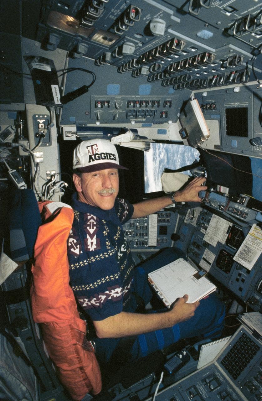 Astronaut Richard Covey at commander's station in Endeavour during STS-61