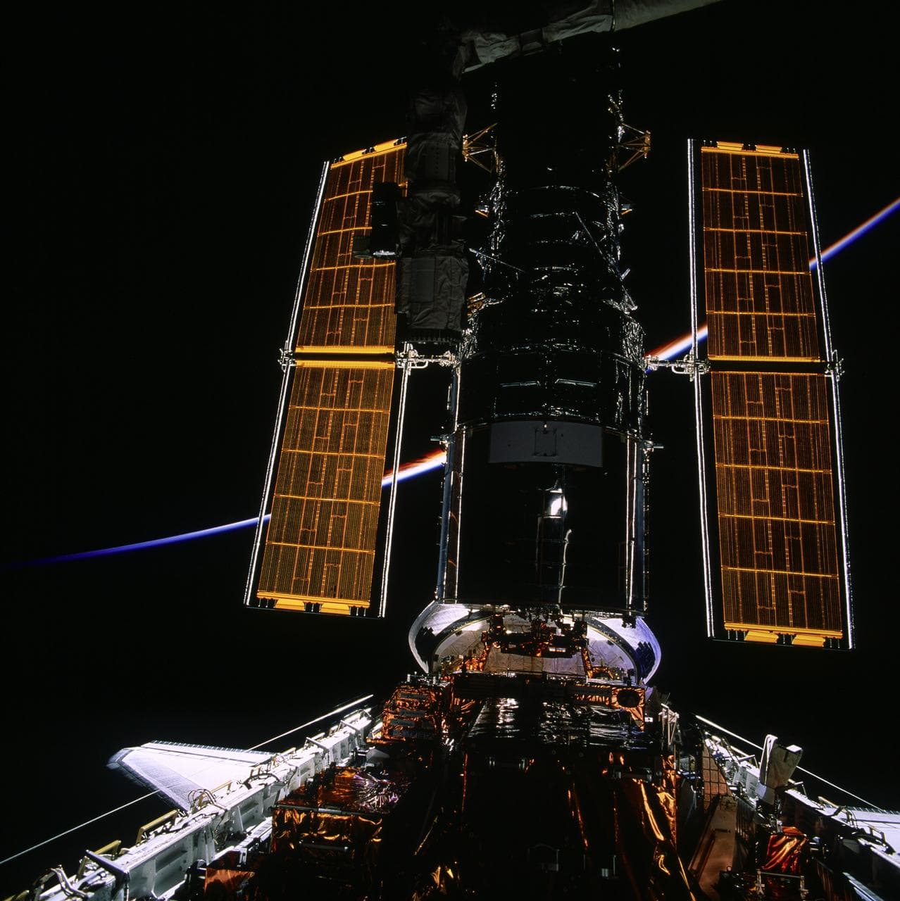 HST, full length views of telescope in payload bay after capture and berthing