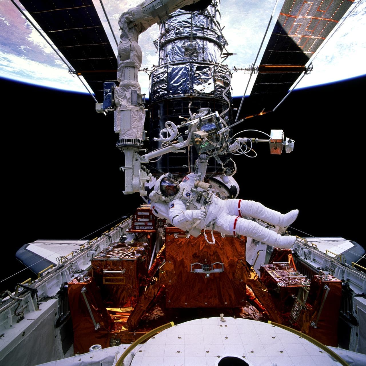 EVA 4 activity on Flight Day 7 to service the Hubble Space Telescope
